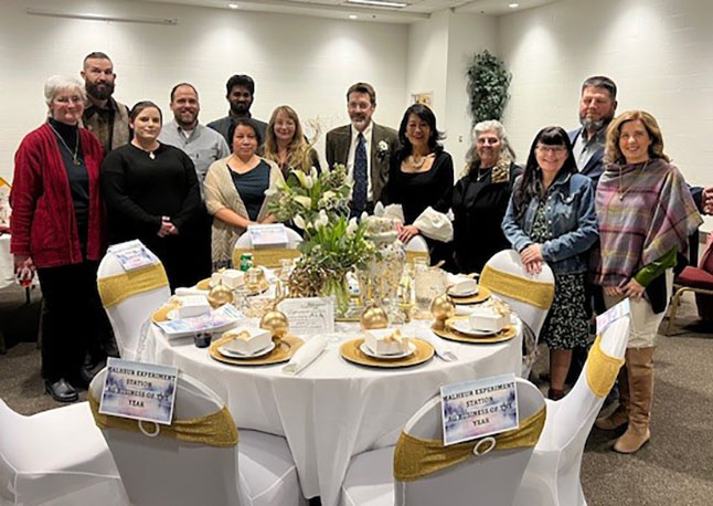 image of the tvcc foundation board standing next to the banquet table the foundation decorated