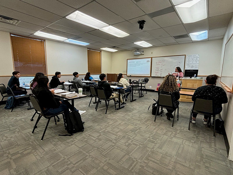 HEP staff assisting students