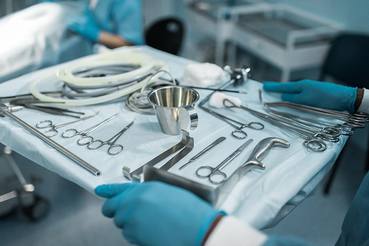 Image of surgical tools on a stainless steel tray